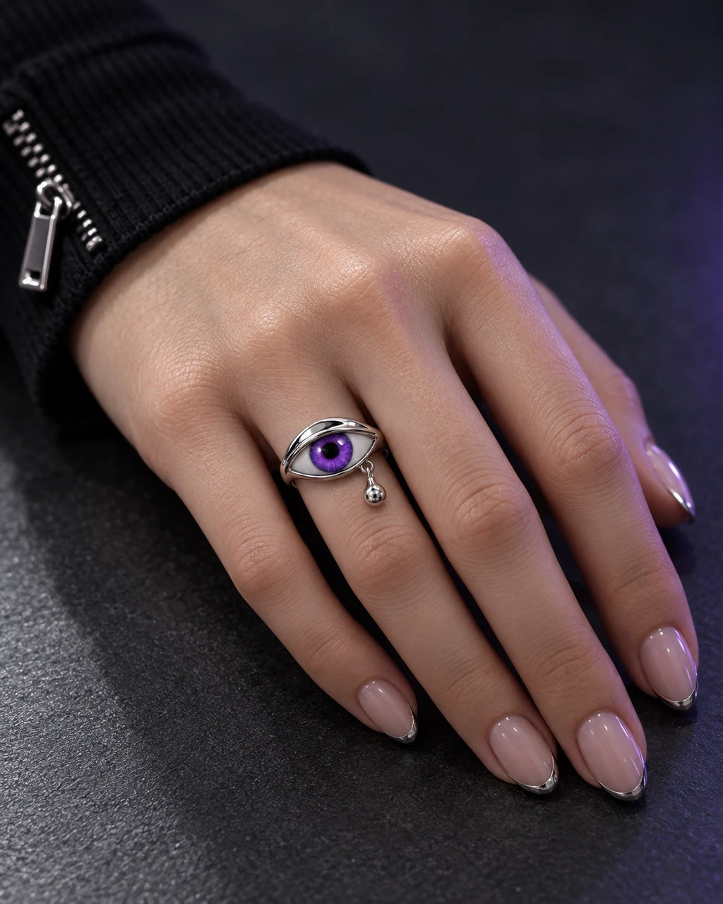 Oracle Eye Ring — Women's hand close-up — Purple / silver