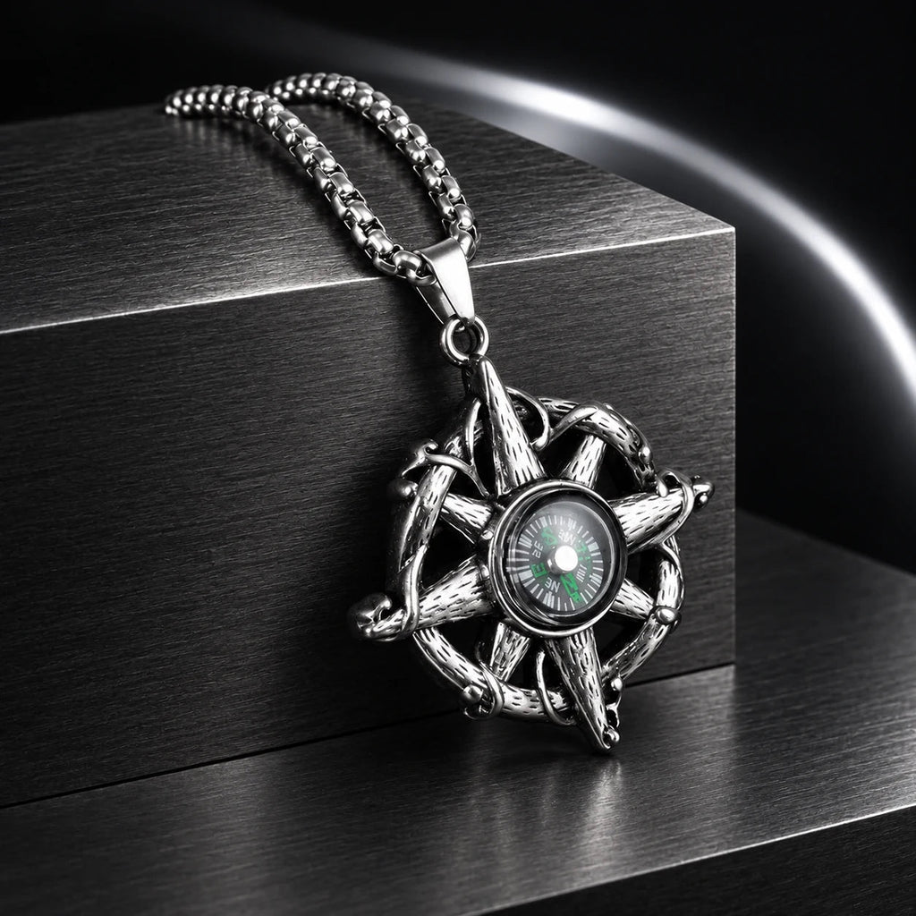 Wayfinder Compass Necklace — silver-tone product in a dark chrome studio setting