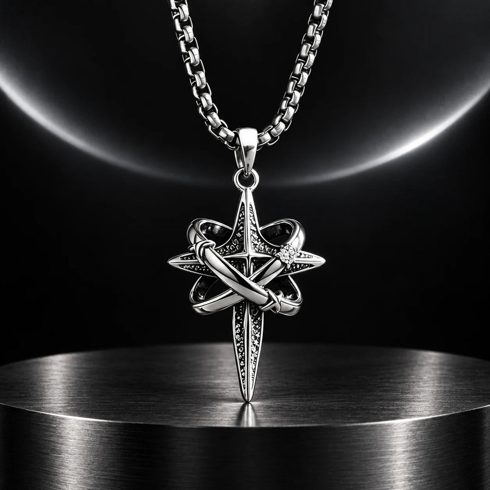 Orbit Cross Necklace — silver-tone product in a dark chrome studio setting