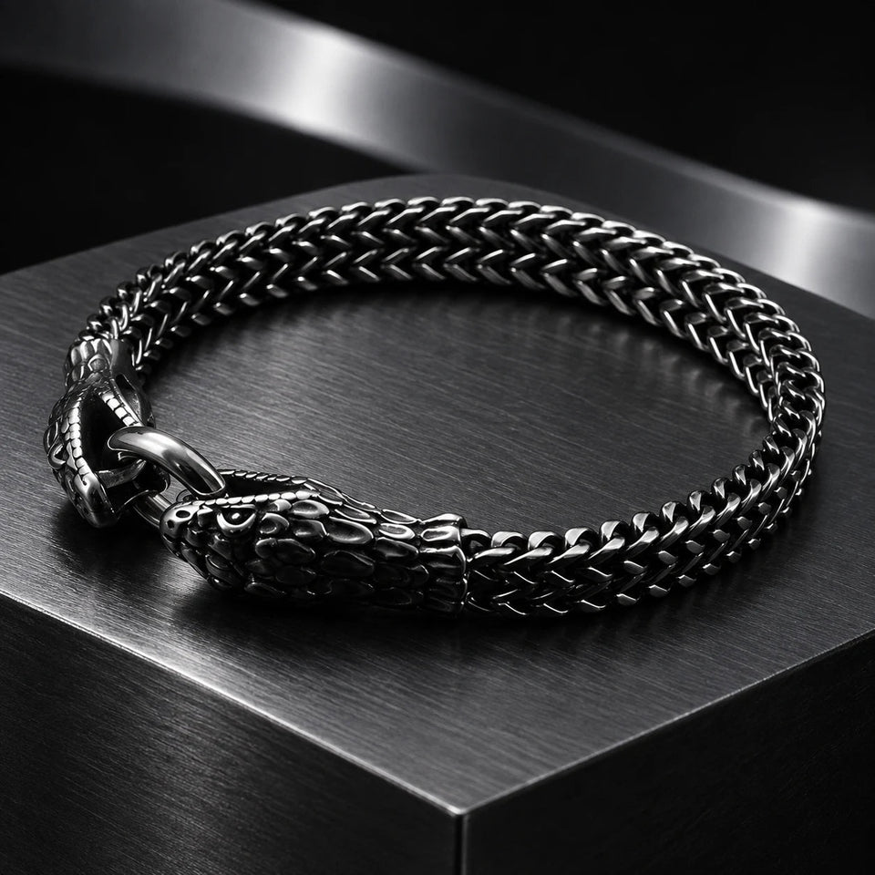 Twin Serpent Bracelet — Dark silver tone in a dark chrome studio setting