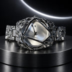 Spiderweb Watch — Silver in a dark chrome studio setting