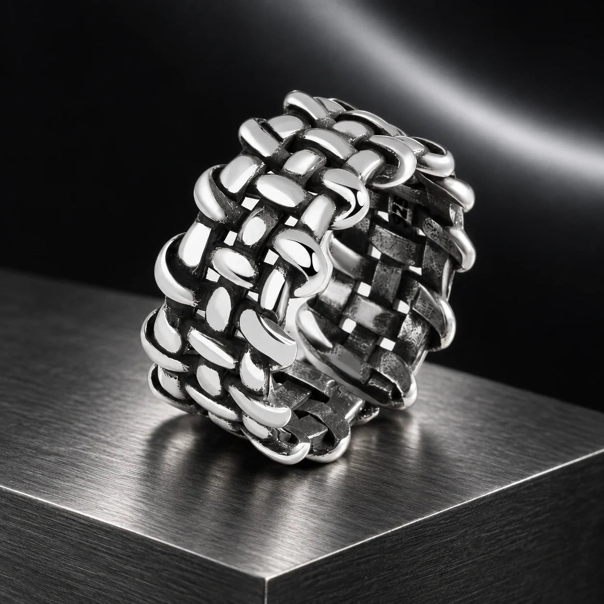 Archive Weave Ring — product in a dark chrome studio setting