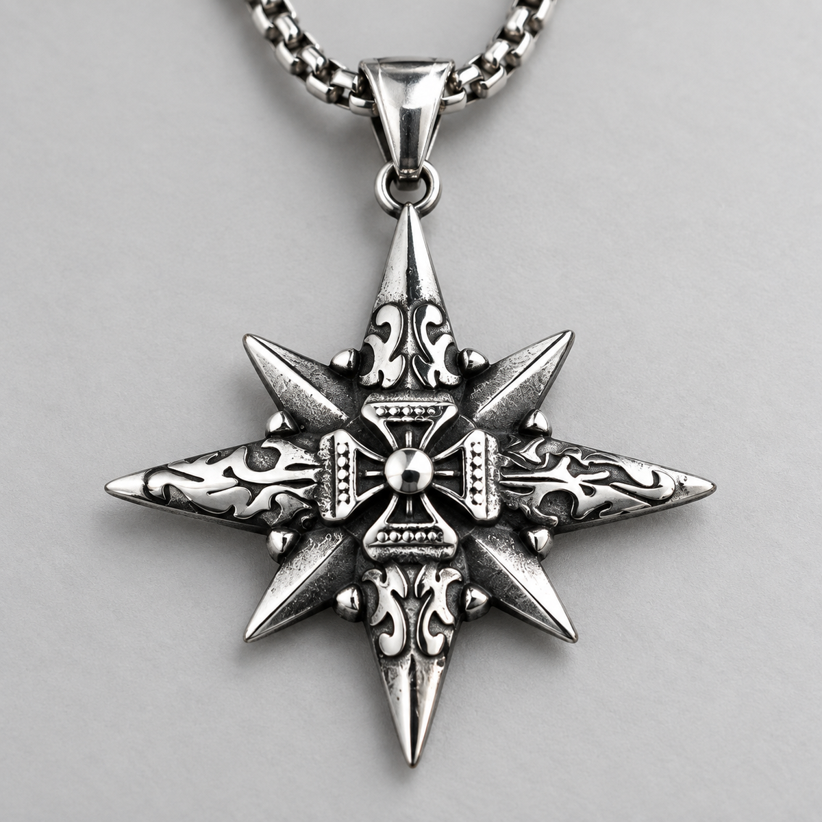 Vesper Cross Necklace close detail of the raised central cross and engraved eight point design